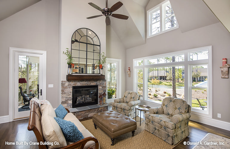 Family room picture showing rear views and windows of luxury house plan 1253 The Chamberlaine