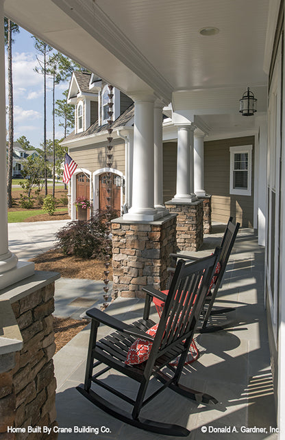 Picturesque front porch and garage  of luxury house plan 1253 The Chamberlaine