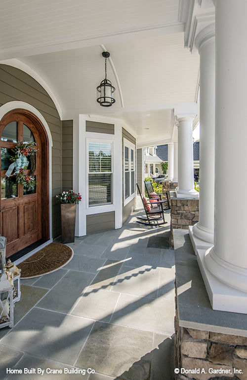 Front porch picture with rocking chairs of luxury house plan 1253 The Chamberlaine