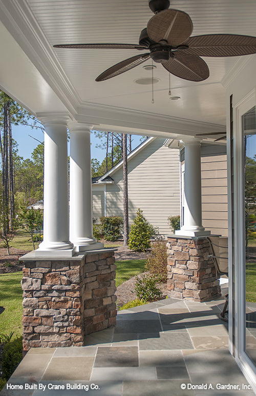 Rear porch view of luxury house plan 1253 The Chamberlaine