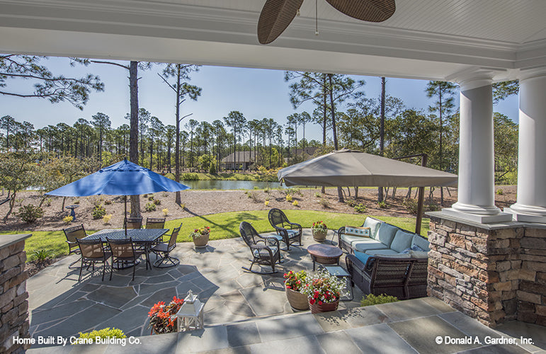 Rear porch picture with patio view of luxury house plan 1253 The Chamberlaine