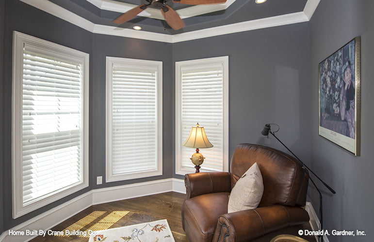 Sitting room with tray ceiling of luxury house plan 1253 The Chamberlaine