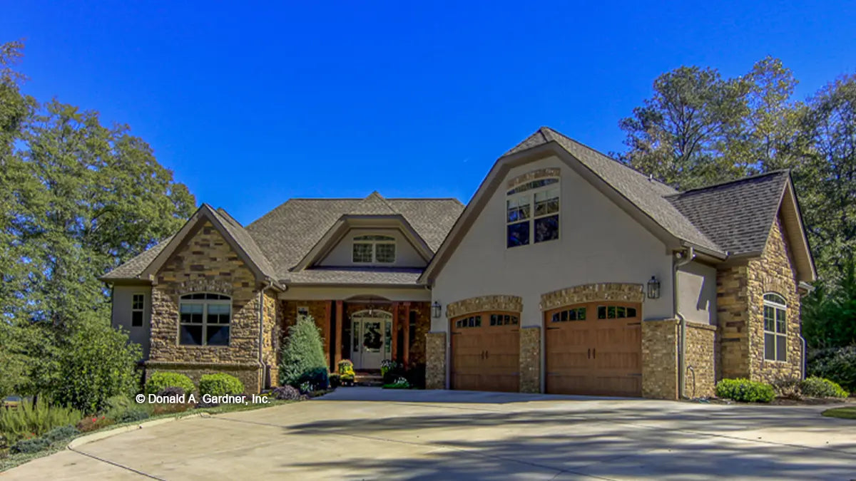 This is a photograph of the front of French country house plan 1284 The Champlain as built by a customer