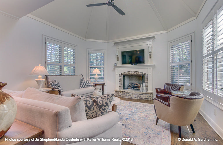 Sunny hearth room with fireplace for Champlain house plan 1284