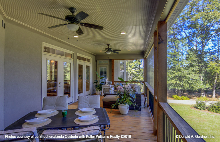 Rear porch with seating pictured for Champlain house plan 1284