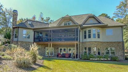 This is a photograph of the rear of cottage house plan 1284 The Champlain as built by a customer