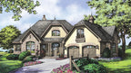 This is an illustration of the front of French country house plan 1284 The Champlain