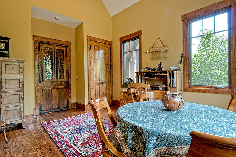 Wood flooring and yellow walls in the breakfast room. The Chanticleer plan 810.