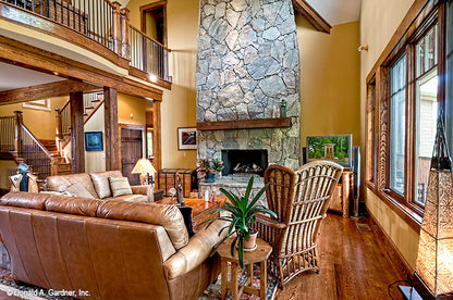 Floor to ceiling stone fireplace in the great room. The Chanticleer plan 810.