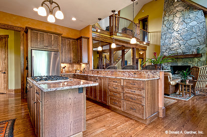 Wood cabinets and flat ceiling in the kitchen. The Chanticleer plan 810.