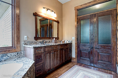 French doors in the master bathroom. The Chanticleer plan 810.