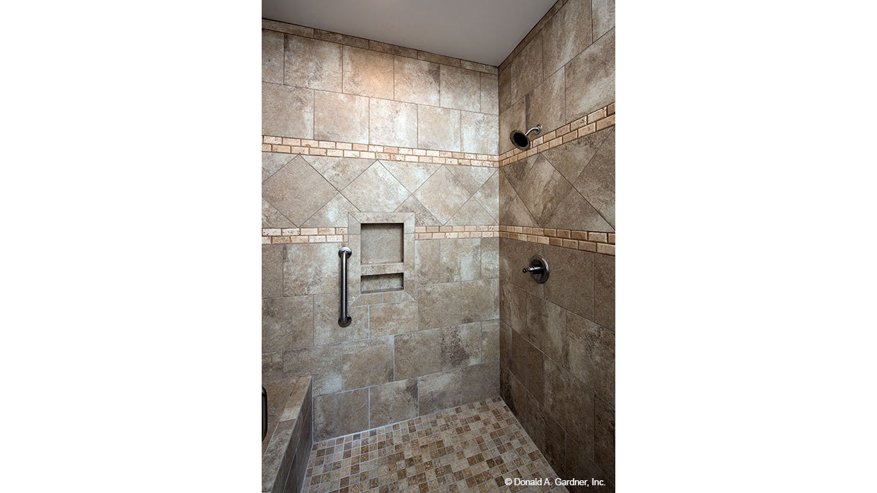 Tiled walk-in shower in the master bathroom. The Charlevoix plan 1068.