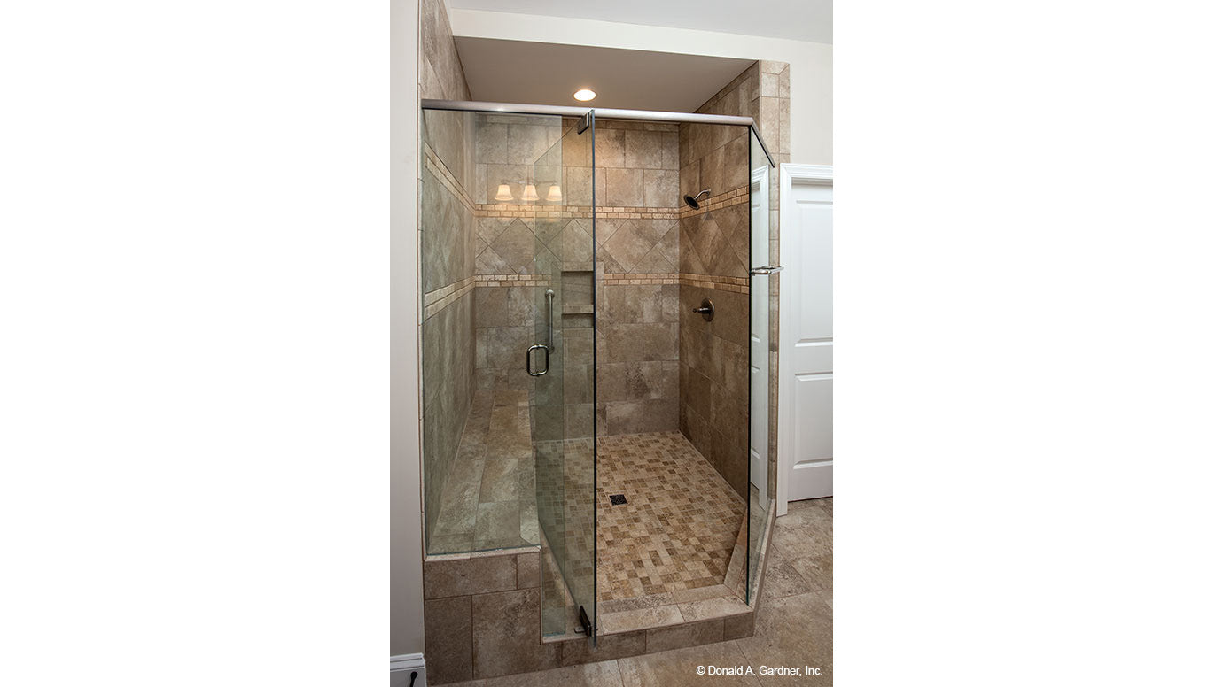 Glass door on the walk-in shower in the master bathroom. The Charlevoix plan 1068.