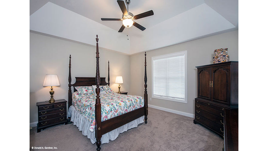 Tray ceiling with ceiling fan in the master bedroom. The Charlevoix plan 1068.