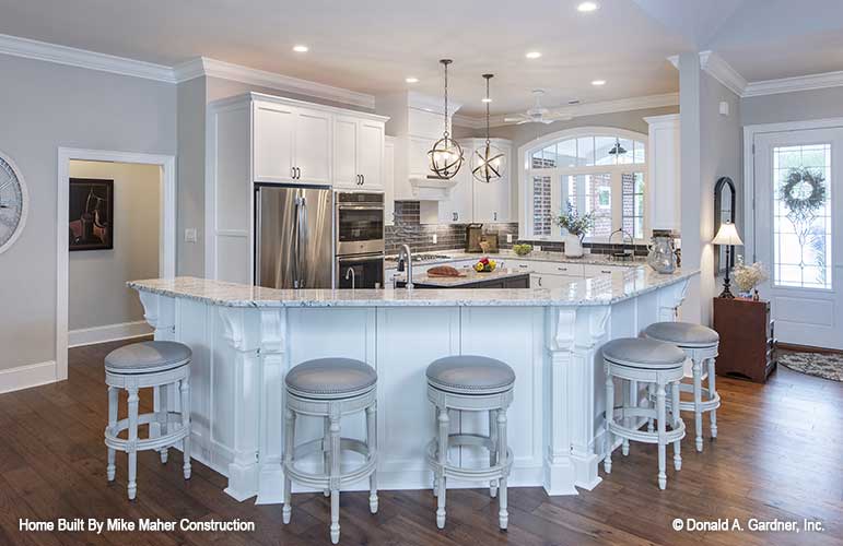 Kitchen counter and bar seating pictured for house plan 1322 The Charlton