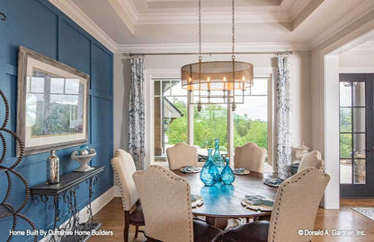 Tray ceiling and large window in the dining room. The Chatsworth plan 1301.