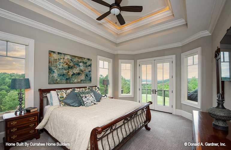 Tray ceiling and French patio doors in the master bedroom. The Chatsworth plan 1301