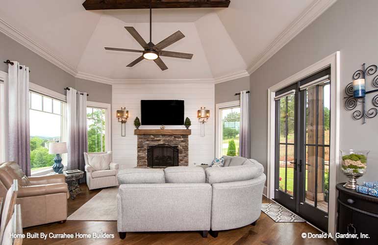 Fireplace in the sunroom with French patio doors. The Chatsworth plan 1301.