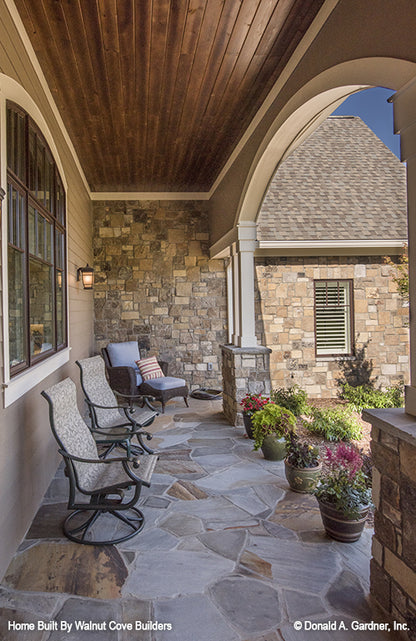 Front porch with sitting area for Chesnee house plan 1290