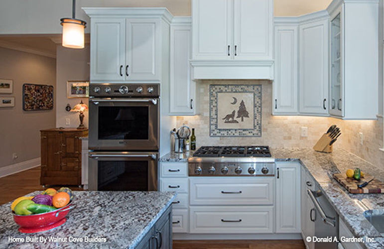 Kitchen with double over, stove and island for Chesnee house plan 1290