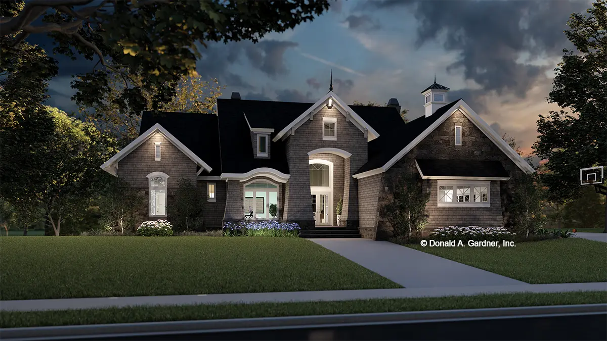 This is an illustration of the front of house plan 1368 The Cheyenne at dusk