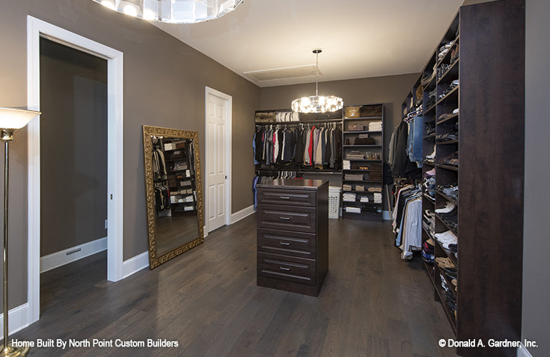 The master bedroom has a spectacular walk-in closet in Modern house plan 1272 The Clearlake