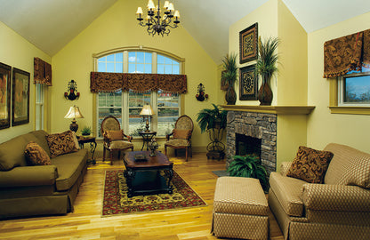 Vaulted ceiling and chandelier in the great room. The Clearly plan 948.