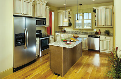 Full kitchen view with island in the center. The Clearly plan 948.