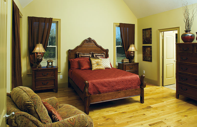 Single windows with bed between them in the master bedroom. The Clearly plan 948. 