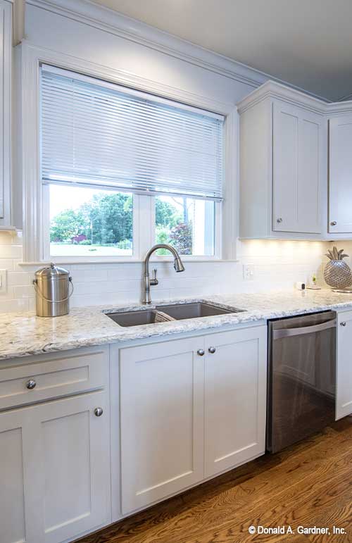 Double window in front of the sink. The Cline plan 1419