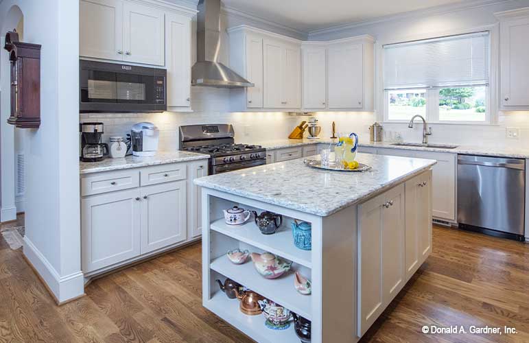 Large island in the middle of the kitchen, perfect for food prepping. The Cline plan 1419