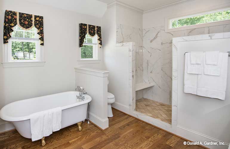 Relaxing oasis in this master bathroom, stand alone clawfoot tub and a walk-in shower. The Cline plan 1419