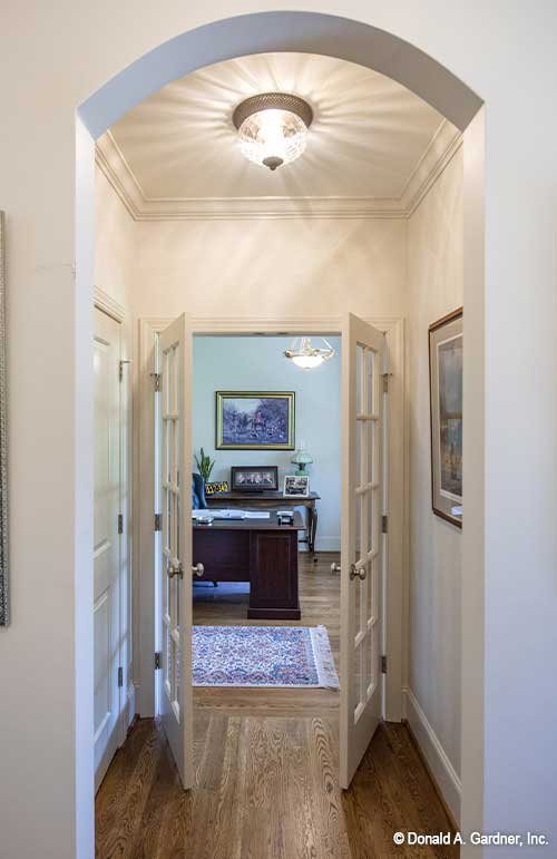 Archway entry leading to French doors to the study. The Cline plan 1419