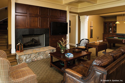 Fireplace and tv in the rec room. The Clubwell Manor plan 5037. 