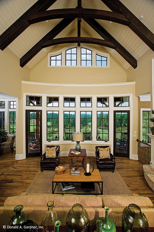 Stained wood beams on the vaulted ceiling in the great room. The Clubwell Manor plan 5037. 