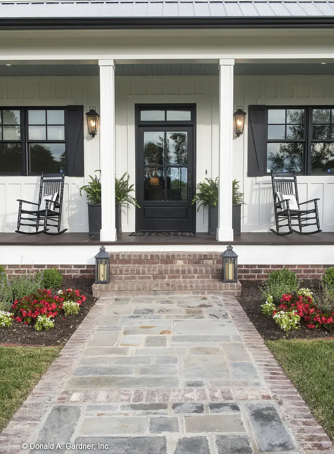 The front porch welcomes visitors to modern farmhouse house plan 1335 The Coleraine