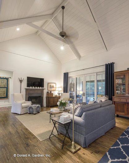 A shiplap ceiling provides a unique touch to one story house plan 1335 The Coleraine