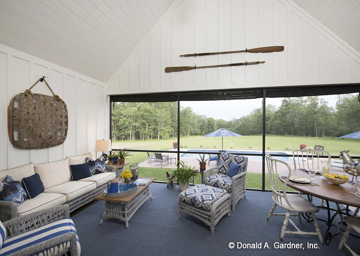 Enjoy the outdoors sheltered from the elements on the screen porch of modern farmhouse house plan 1335 The Coleraine