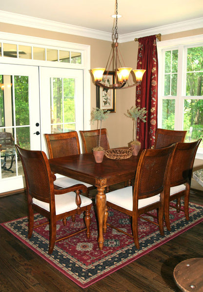 Crown molding along the ceiling and chandelier in the dining room. The Collier plan 1216.