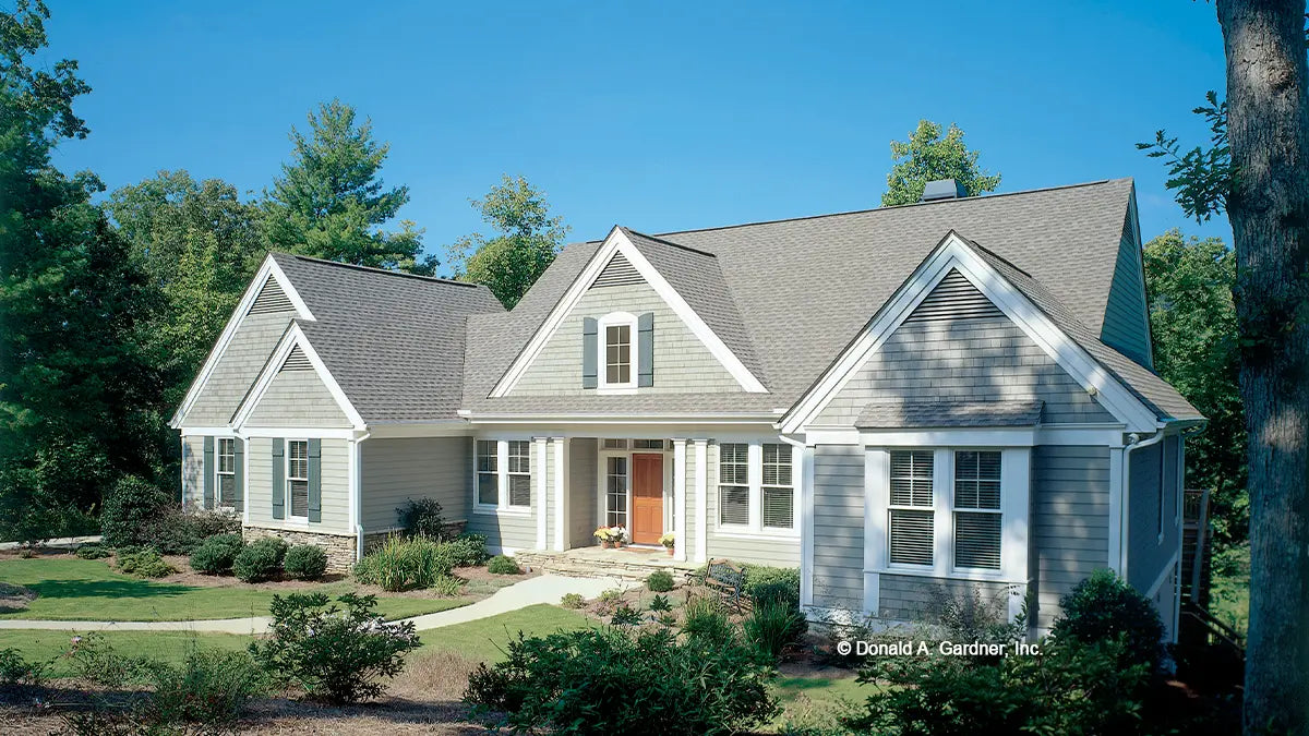 Front view photograph with a cozy front porch. Photograph submitted by the customer. The Colridge plan 1012.