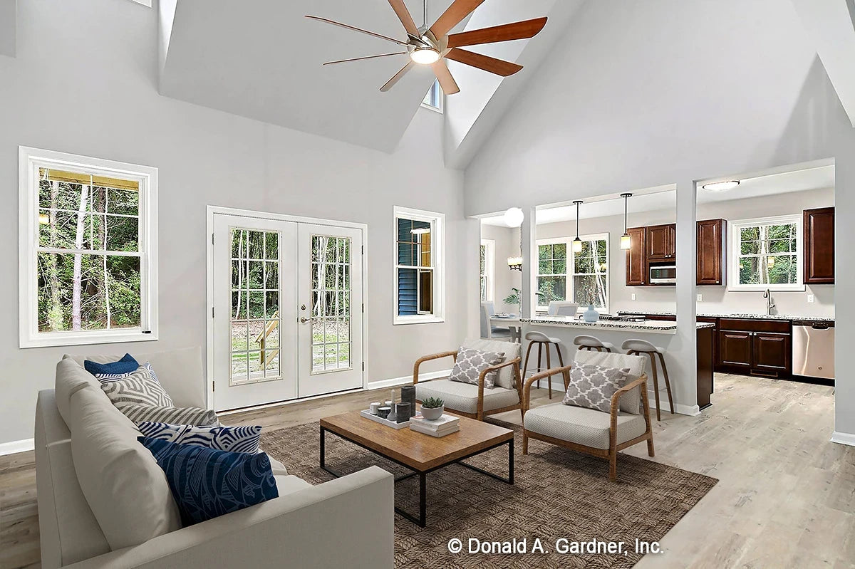 Great room open to the kitchen and breakfast nook, featuring sky lights