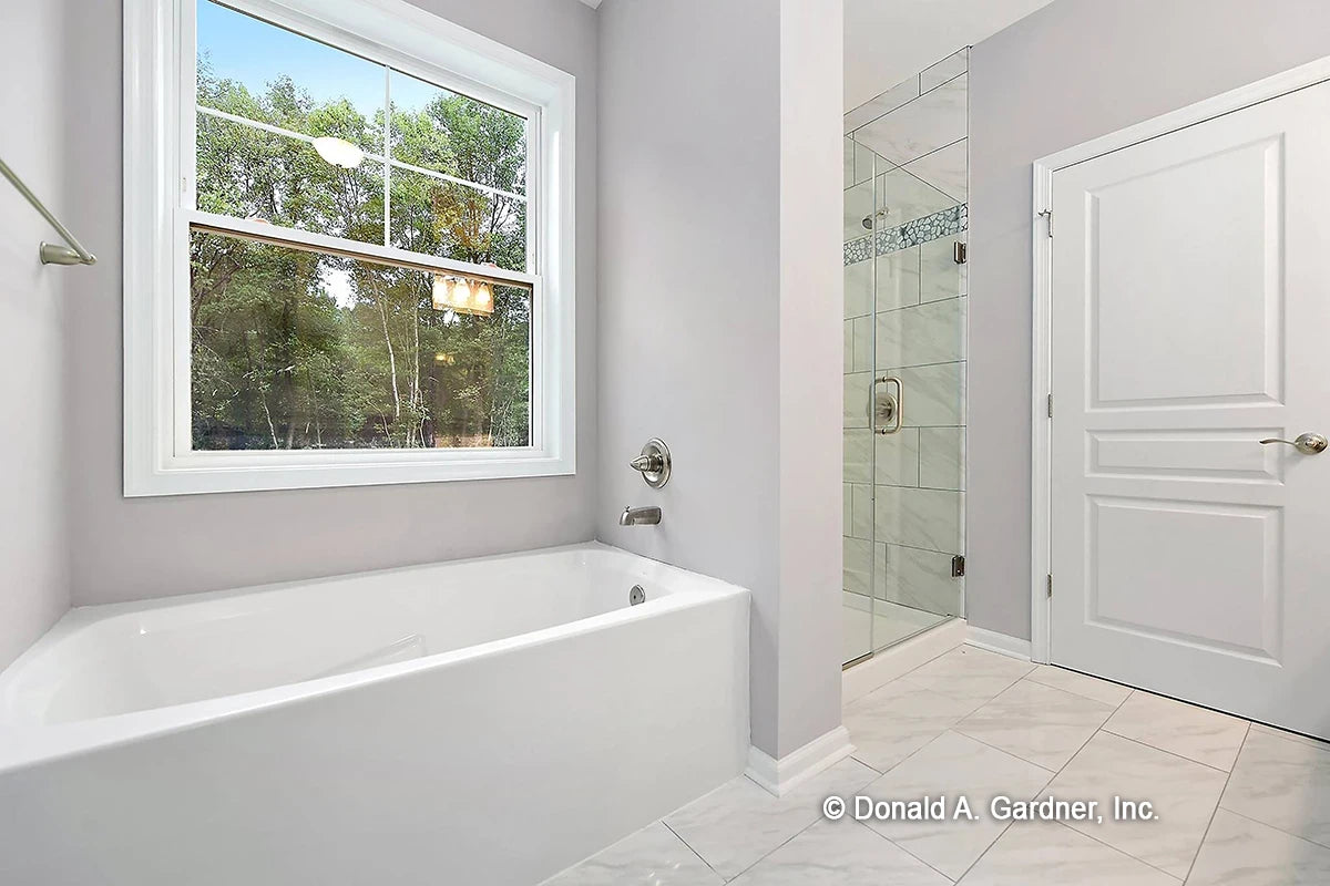 Master bathroom with large walk-in shower and soaking tub