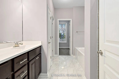 Bathroom with bathtub and linen closet