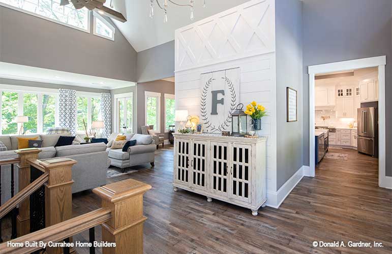 This is a photograph of the foyer and stair entry of luxury house plan 732 The Crowne Canyon as built by a customer