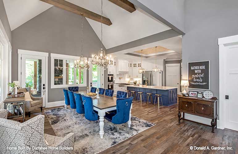 This is a photograph of the dining room and kitchen of luxury house plan 732 The Crowne Canyon as built by a customer