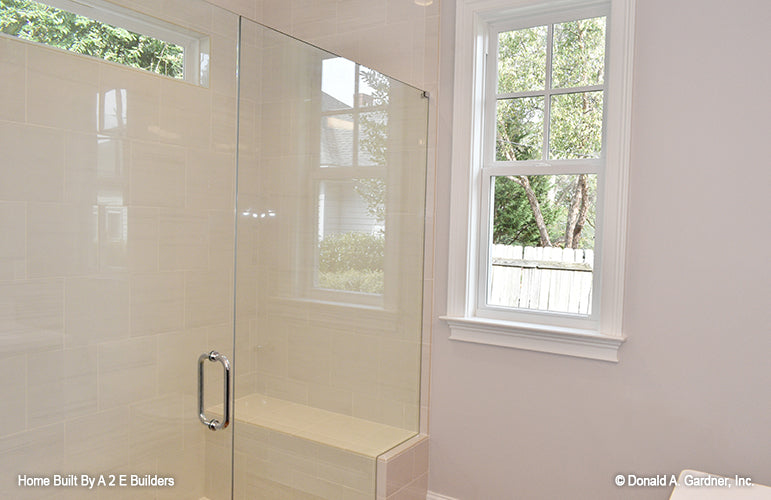 This is a picture of the master shower and light-giving windows in the master bath of house plan 1025 The Currier