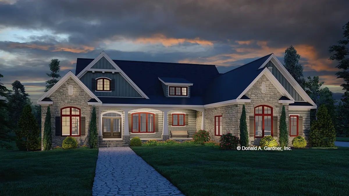 This is an illustration of the front of ranch house plan 1535 The Curtis at dusk