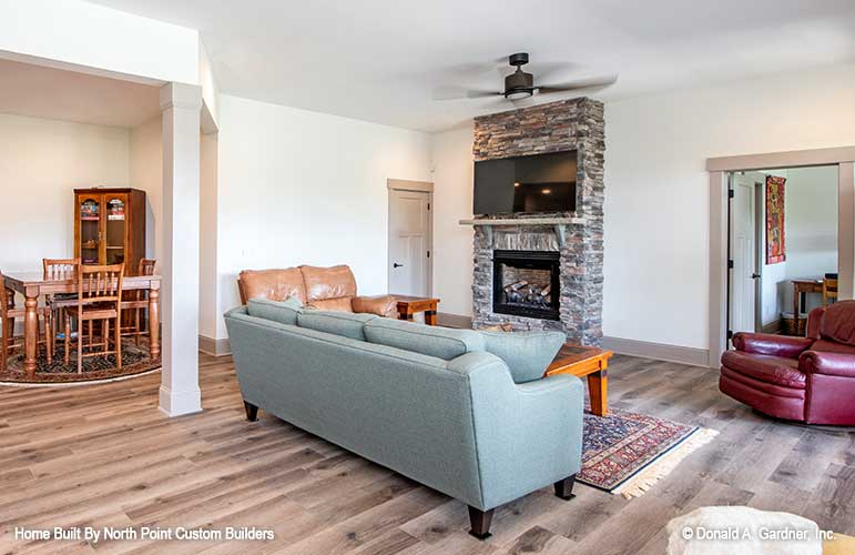 Another look into the entertainment room with the stone fireplace. Dawson plan 1502