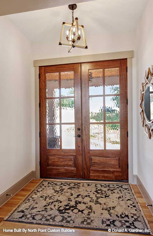 Inviting foyer with double glass doors. Dawson plan 1502