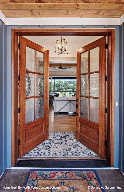 Double glass doors opening welcoming you into the foyer. Dawson plan 1502